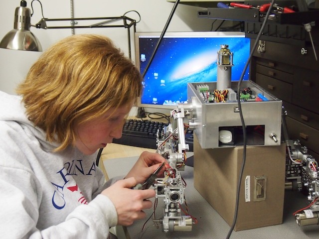 Camille finishes up some wiring on the chassis.