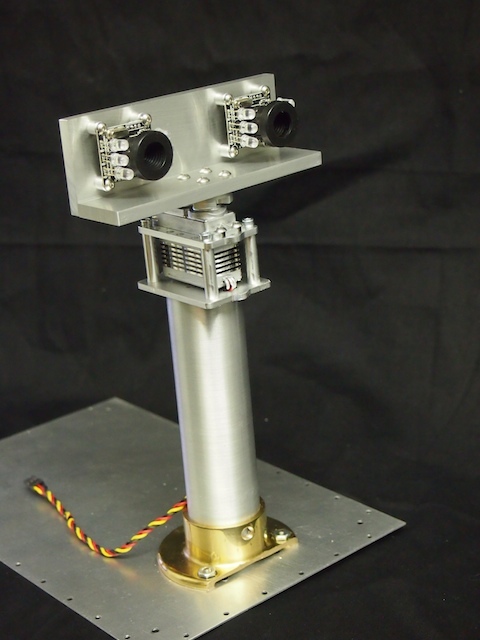 Here is the completed mast assembly. From the bottom up: The robot's bottom plate, the mast flange, the mast tube, the custom servo plate, the pan servo, the top servo plate, the servo horn, and the mast head, which is made out of two custom machined plates of aluminum.